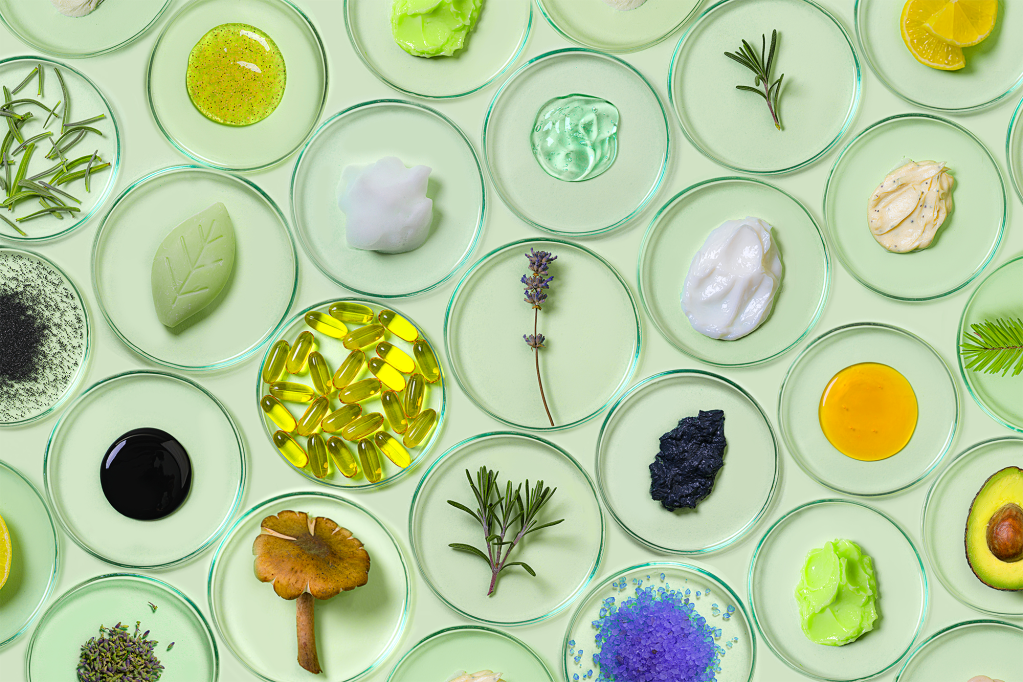 skincare pattern; serums, moisturizers on green background