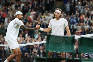 Nick Kyrgios (AUS) (L) shakes hands with Stefanos Tsitsipas (GRE) after their Gentlemen's Singles 3rd Round match during day six of The Championships Wimbledon 2022 at All England Lawn Tennis and Croquet Club on July 2, 2022.