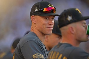 Aaron Judge looks on from the dugout during the All-Star Game at Dodger Stadium.