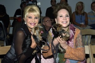 Ivana Trump and Cindy Adams posing with their dogs in 2004.