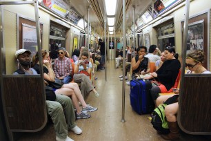 People ride Subway train in New York.