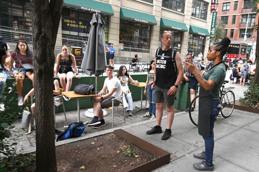 A Sweetgreen worker demands tourists to leave its dining area for not buying food.