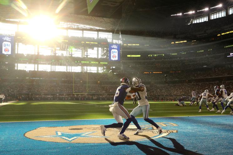 Collin Johnson #15 of the New York Giants battles in the end zone with Anthony Brown #30 of the Dallas Cowboys.