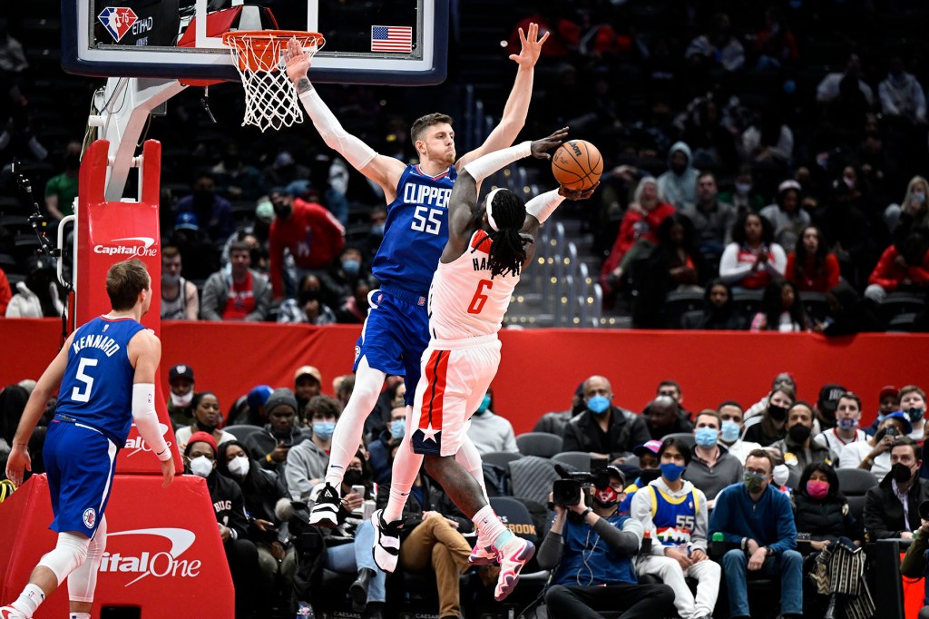 Montrezl Harrell #6 of the Washington Wizards drives to the basket against Isaiah Hartenstein #55 of the LA Clippers at Capital One Arena on January 25, 2022 in Washington, DC. 