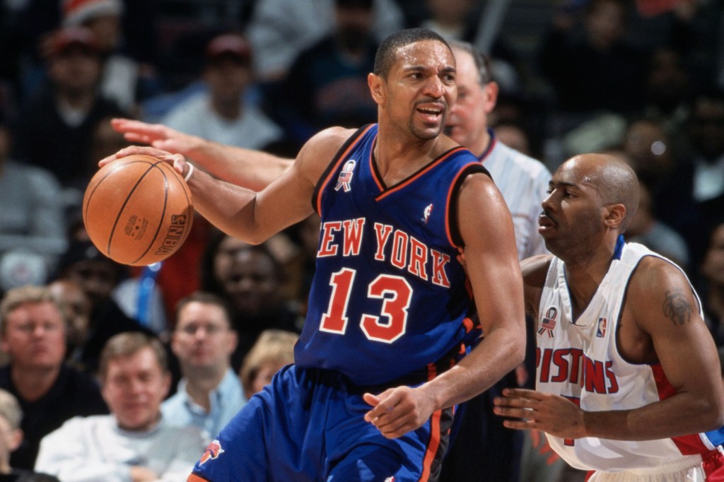 Point guard Mark Jackson #13 of the New York Knicks posts up point guard Chucky Atkins #7 of the Detroit Pistons during the NBA game at the Palace of Auburn Hills in Detroit, Michigan. The Pistons defeated the Knicks 99-97.