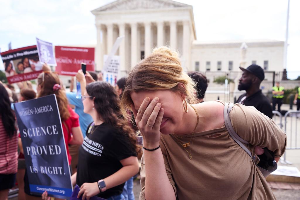 Anti-abortion protesters celebrate after the Supreme Court overturned the 49-year-old landmark Roe v. Wade decision in front of the U.S. Supreme Court on Friday, June 24, 2022 in Washington, D.C.