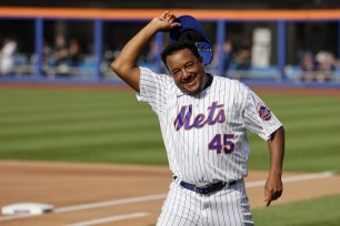 Pedro Martinez tips his cap as he's introduced at the Mets' Old-Timers' Day before a game against the Rockies, Saturday, Aug. 27, 2022.