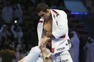 ictor Estima of Brazil competes with Leandro Lo of Brazil in the Men's black belt 82kg finals during the Abu Dhabi World Professional Jiu-Jitsu Championship at First Gulf Bank Arena on April 17, 2014.