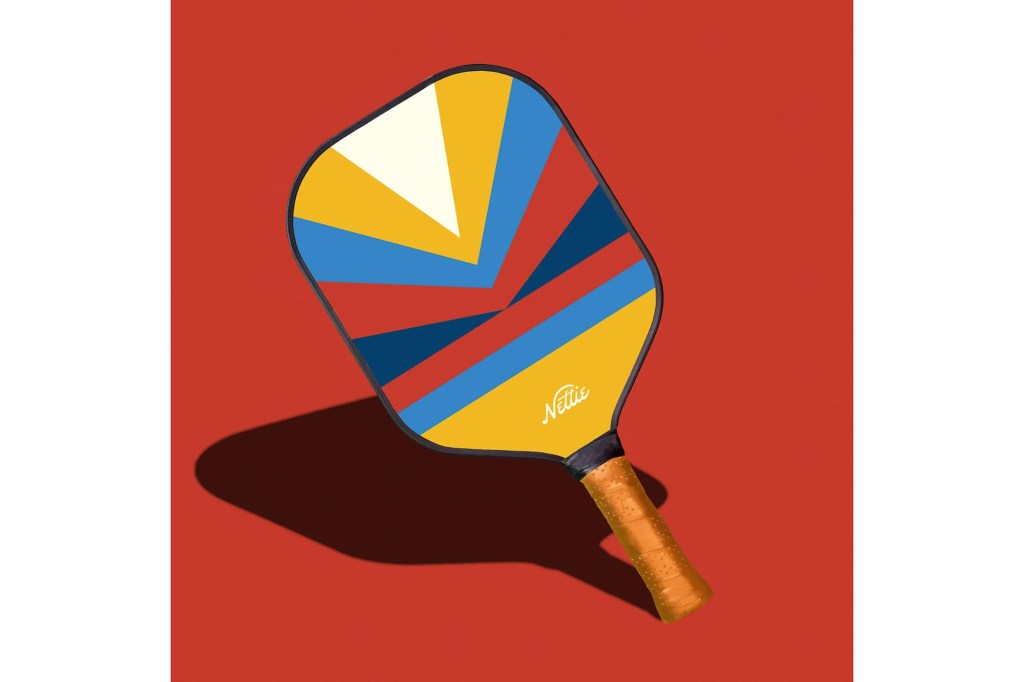 A red, yellow and blue pickleball paddle 