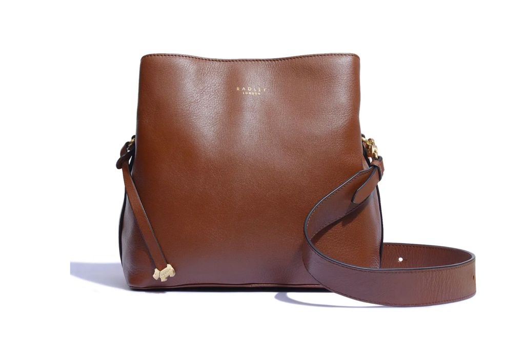 Medium size brown leather bag with strap.