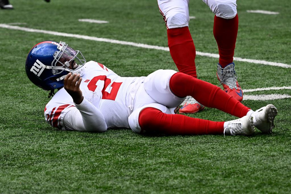 New York Giants quarterback Tyrod Taylor (2) is on the ground after being hit during a preseason game against the New York Jets on August 28, 2022.