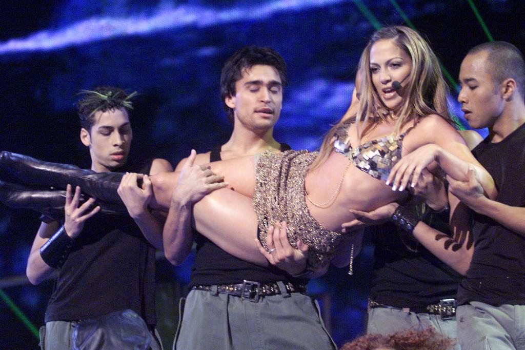 Jennifer Lopez performing on the 1999 Billboard Music Awards at the MGM Grand Garden Arena in Las Vegas in 1999. JLo has a "fast-paced" workout routine and doesn't drink alcohol.