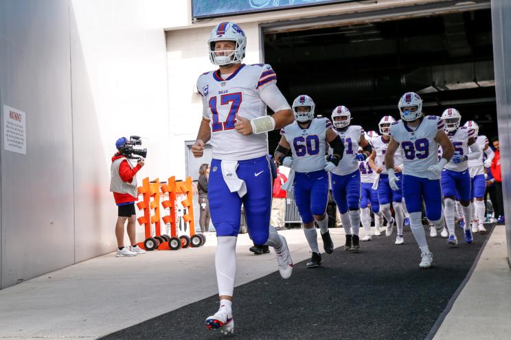 Quarterback Josh Allen #17 of the Buffalo Bills leads his team to the field before the start of the game against the Jacksonville Jaguars.