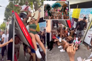 Video shows London bus-stop roof collapsing on passersby as carnival goers dance on top.