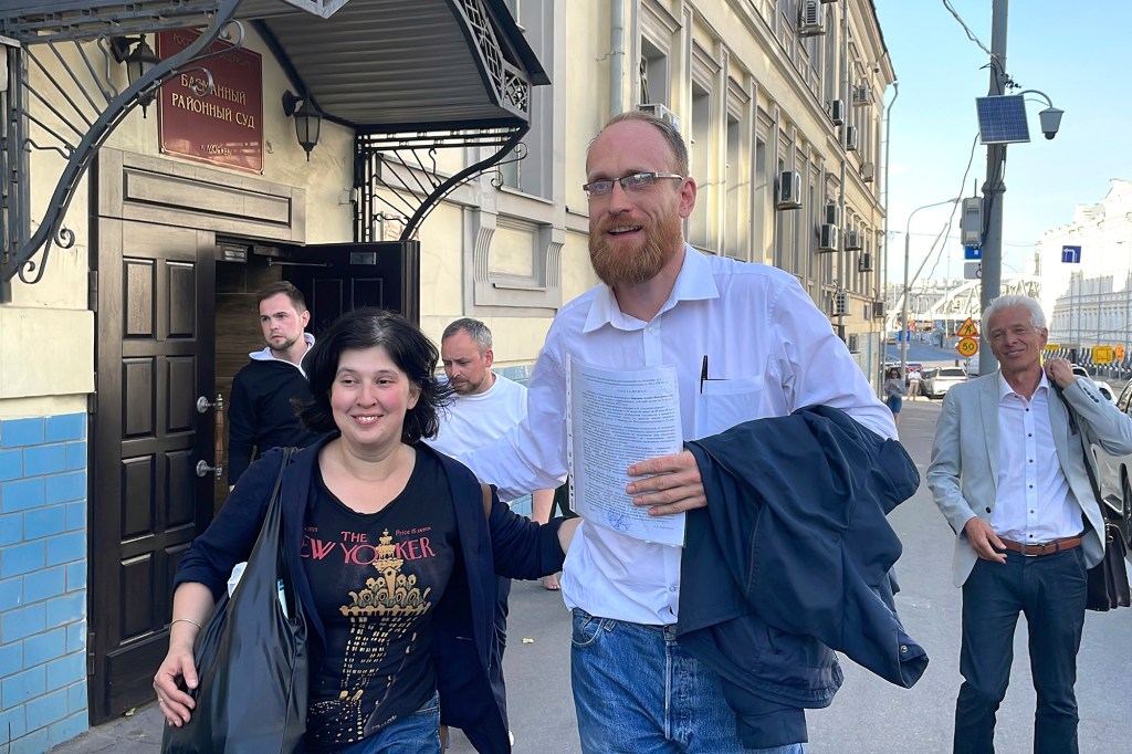 Independent Russian journalist Andrei Zayakin, center, walks from a court after a hearing in Moscow, Russia, Monday, Aug. 29, 2022.