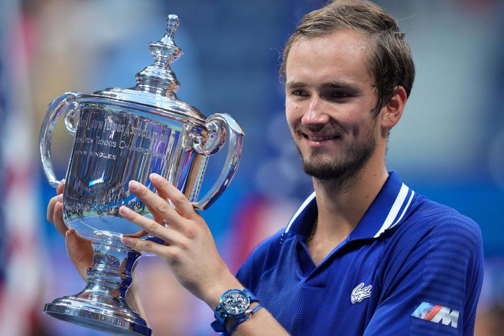 Daniil Medvedev of Russia celebrates with the championship trophy after his match against Novak Djokovic of Serbia (not pictured) in the men's singles final on day fourteen of the 2021 U.S. Open.