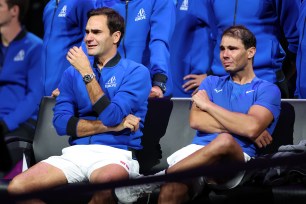 Roger Federer, left, and Rafael Nadal get emotional following Federer's final match Friday at the Laver Cup in London.