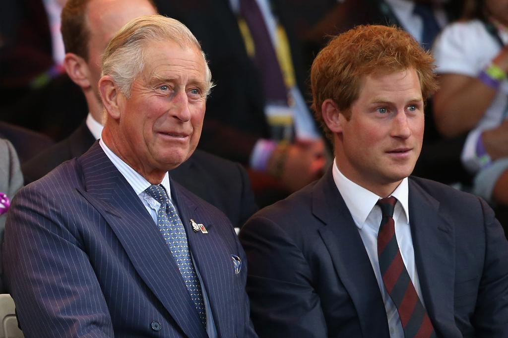 LONDON, ENGLAND - SEPTEMBER 10: Prince Charles, Prince of Wales and Prince Harry laugh during the Invictus Games Opening Ceremony on September 10, 2014 in London, England. The International sports event for 'wounded warriors', presented by Jaguar Land Rover, is just days away with limited last-minute tickets available at www.invictusgames.org (Photo by Chris Jackson/Getty Images)