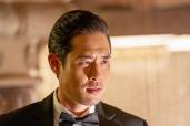 Raymond Lee as Dr. Ben Song. He's wearing a tuxedo and is looking very serious.