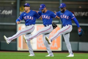 The Texas Rangers' Leody Taveras, Adolis Garcia, and Bubba Thompson.
