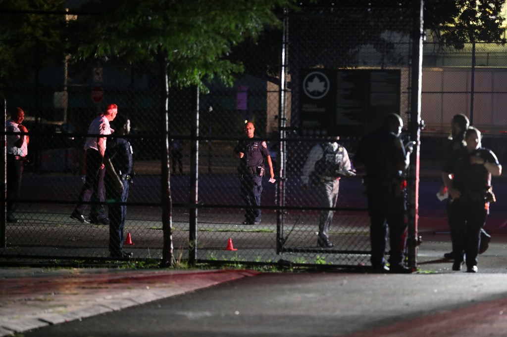 Police at the scene of the shooting that stemmed from a dispute on the basketball court at Arcilla Playground in the Bronx.