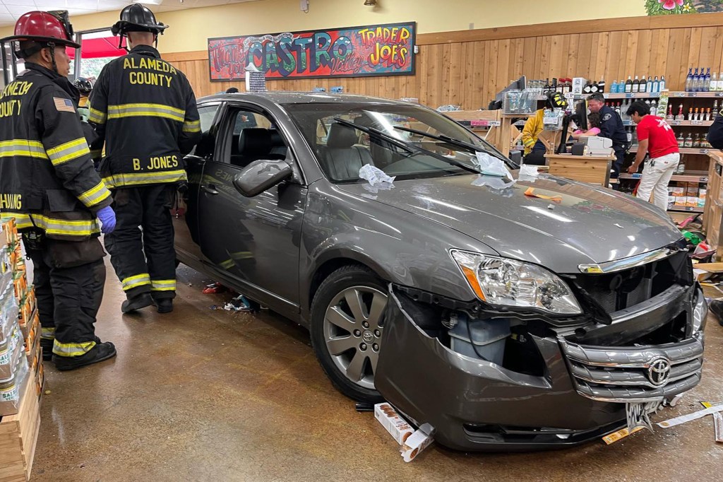 Alameda County Fire Department investigates the aftermath of a crash at a Castro Valley Trader Joe's on Sept. 15, 2022.