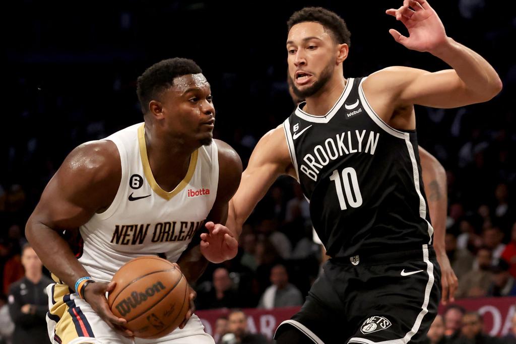 New Orleans Pelicans forward Zion Williamson (1) drives to the basket against Brooklyn Nets guard Ben Simmons (10) during an NBA game at Barclays Center on October 19, 2022.