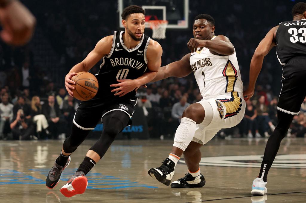 Brooklyn Nets guard Ben Simmons (10) controls the ball against New Orleans Pelicans forward Zion Williamson (1) during an NBA game on October 19, 2022.