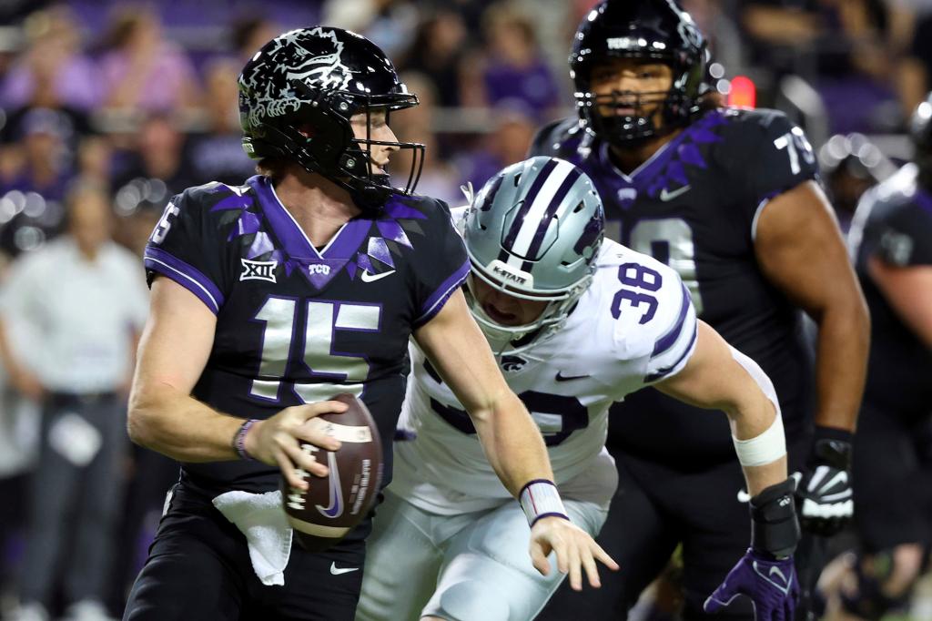TCU quarterback Max Duggan (15) looks to pass as he is pursued by Kansas State defensive end Brendan Mott (38) during an NCAA college football game Saturday, Oct. 22, 2022.