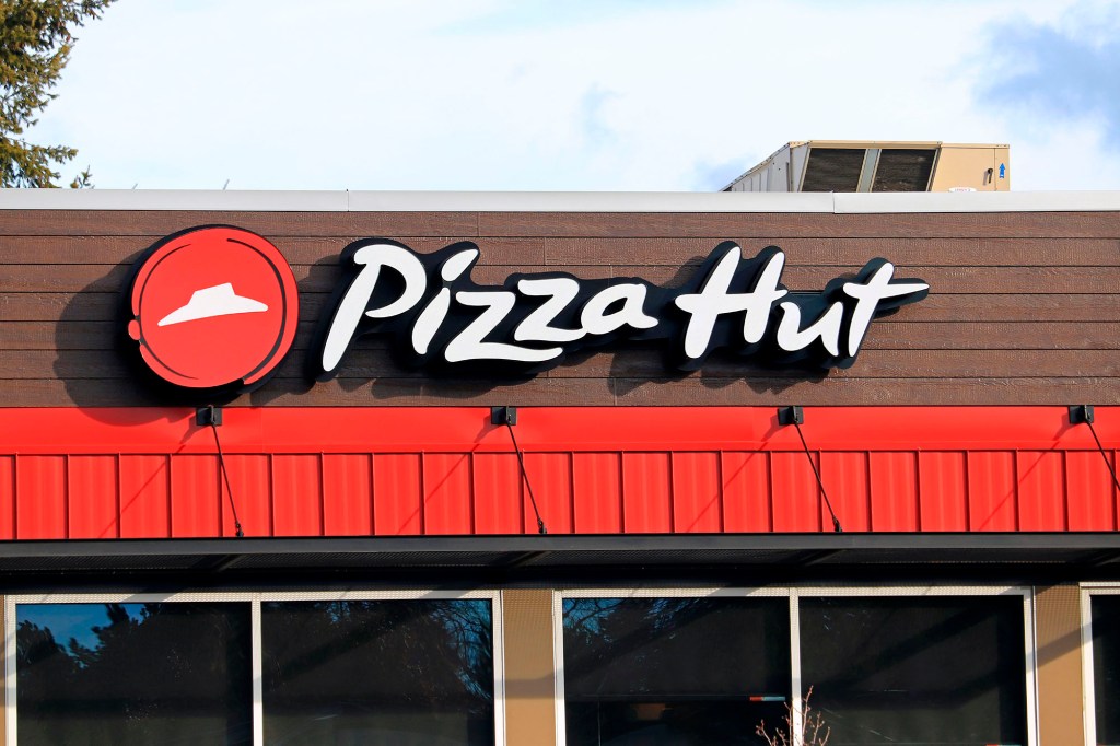 Pizza Hut company logo on building, northern Idaho.