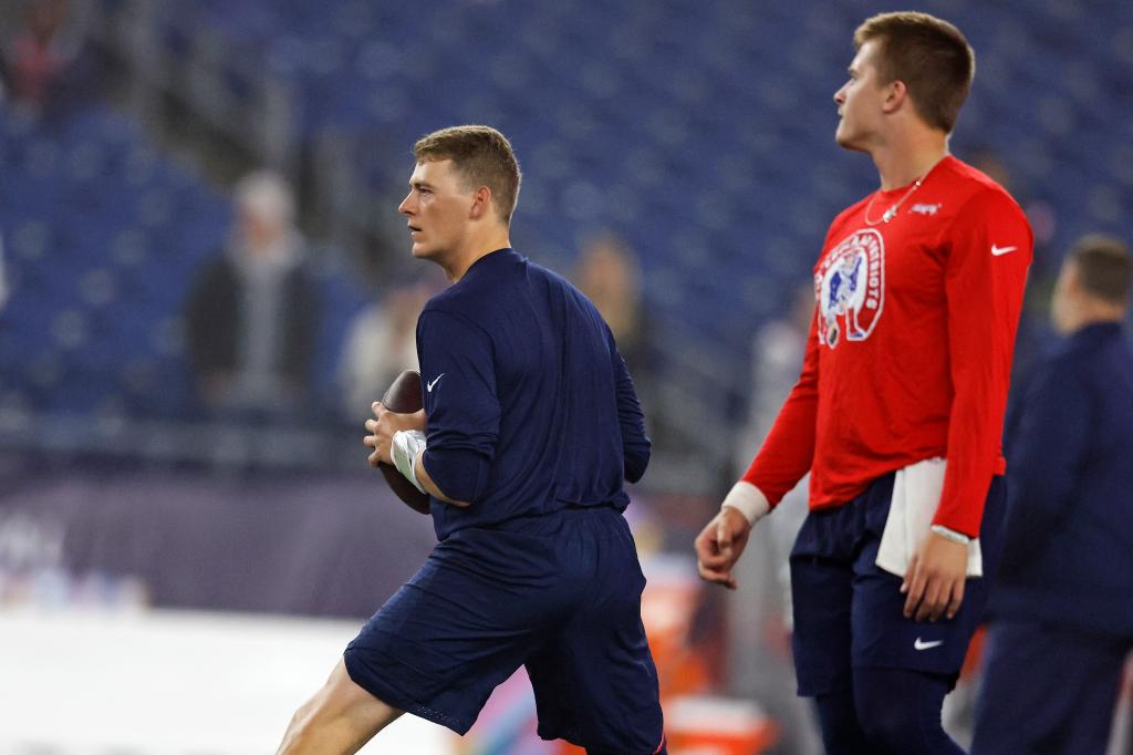 Mac Jones (left) and Bailey Zappe before the game.