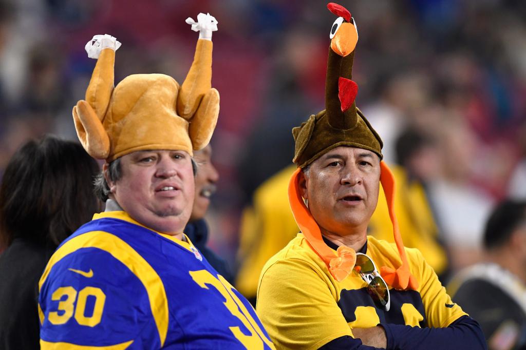 Fans wear turkey hats in honor of Thanksgiving as they attend the game between the Kansas City Chiefs and the Los Angeles Rams at Los Angeles Memorial Coliseum on November 19, 2018.