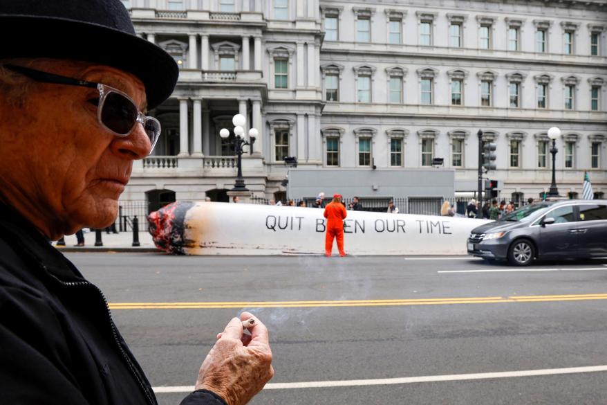 A man smoking marijuana at the White House protest.