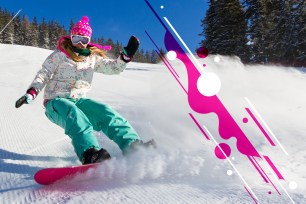 Female snowboarder on the slopes on a sunny morning in the Italian alps