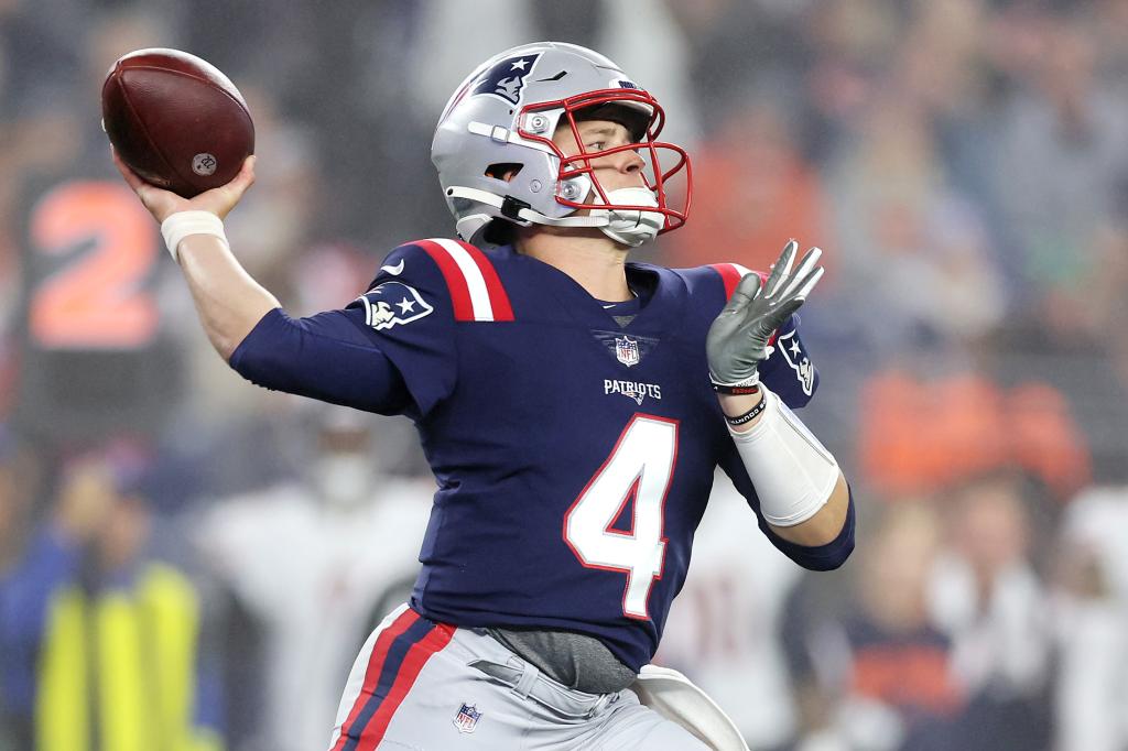 Bailey Zappe throws a pass against the Bears.