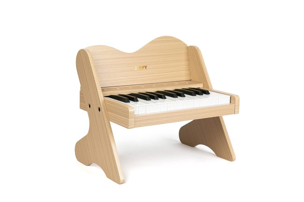 A small wooden piano with legs