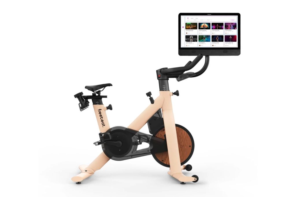Immersive gamified exercise bike with screen.