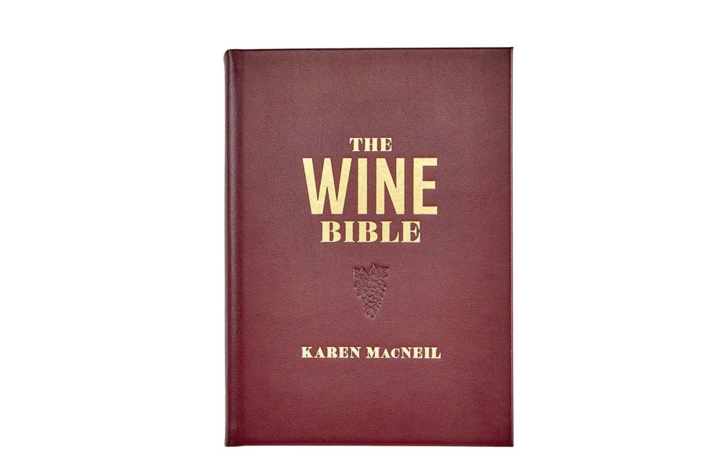 A dark red book with the title "The Wine Bible" on its covered in gold lettering.