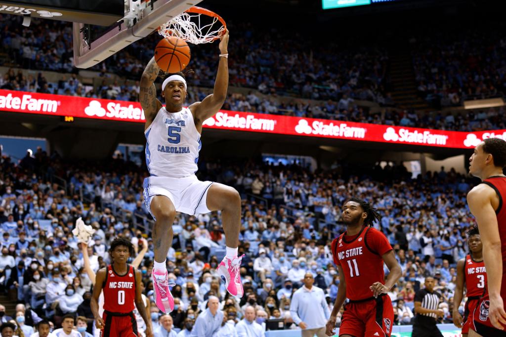 Armando Bacot #5 of the North Carolina Tar Heels dunks the ball against the NC State Wolfpack in the second half at Dean E. Smith Center on January 29, 2022 in Chapel Hill, North Carolina.