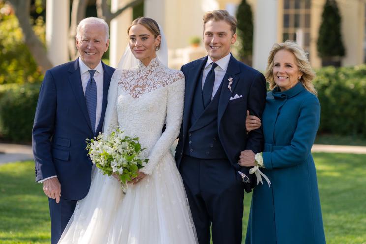 President Joe Biden is pictured with his granddaughter Naomi Biden and her husband Peter Neal and Jill Biden on her wedding day at the White House