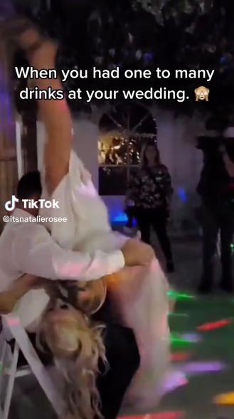 Bride pops her crotch into groom's face at wedding reception