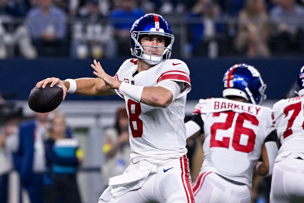 New York Giants quarterback Daniel Jones (8) throws the ball against the Dallas Cowboys during the second half of the game between the Cowboys and the Giants at AT&T Stadium.