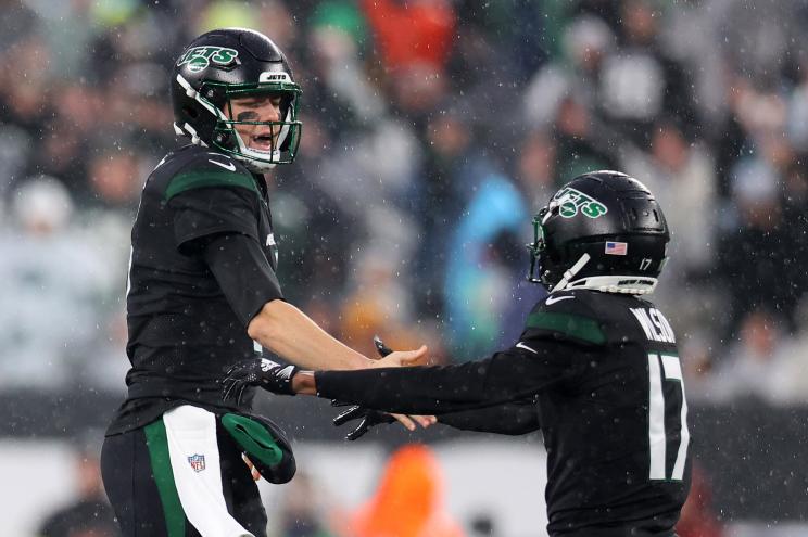 Mike White #5 of the New York Jets celebrates a touchdown pass with Garrett Wilson #17 of the New York Jets in the third quarter of a game against the Chicago Bears at MetLife Stadium on November 27, 2022.