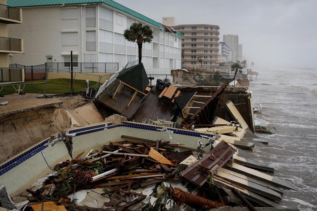 A destroyed pool of a beachfront building is seen after Hurricane Nicole made landfall on Florida's east coast.