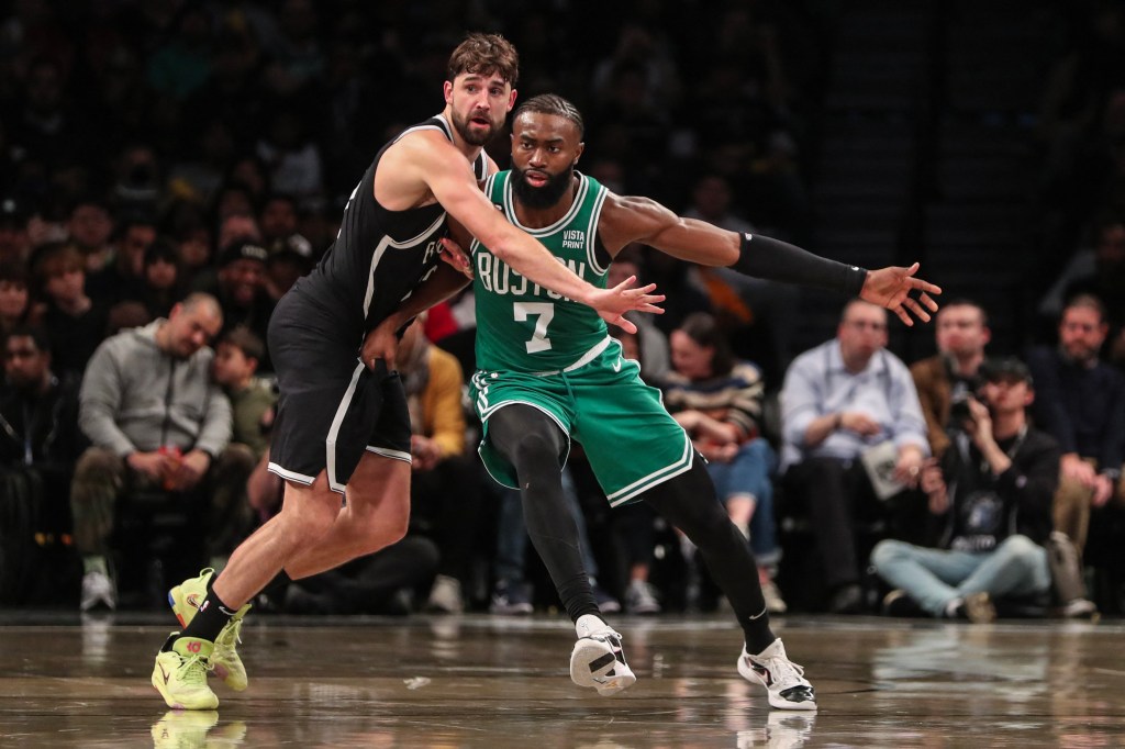 Brooklyn Nets forward Joe Harris (12) and Boston Celtics guard Jaylen Brown (7) battle for position in the third quarter at Barclays Center.