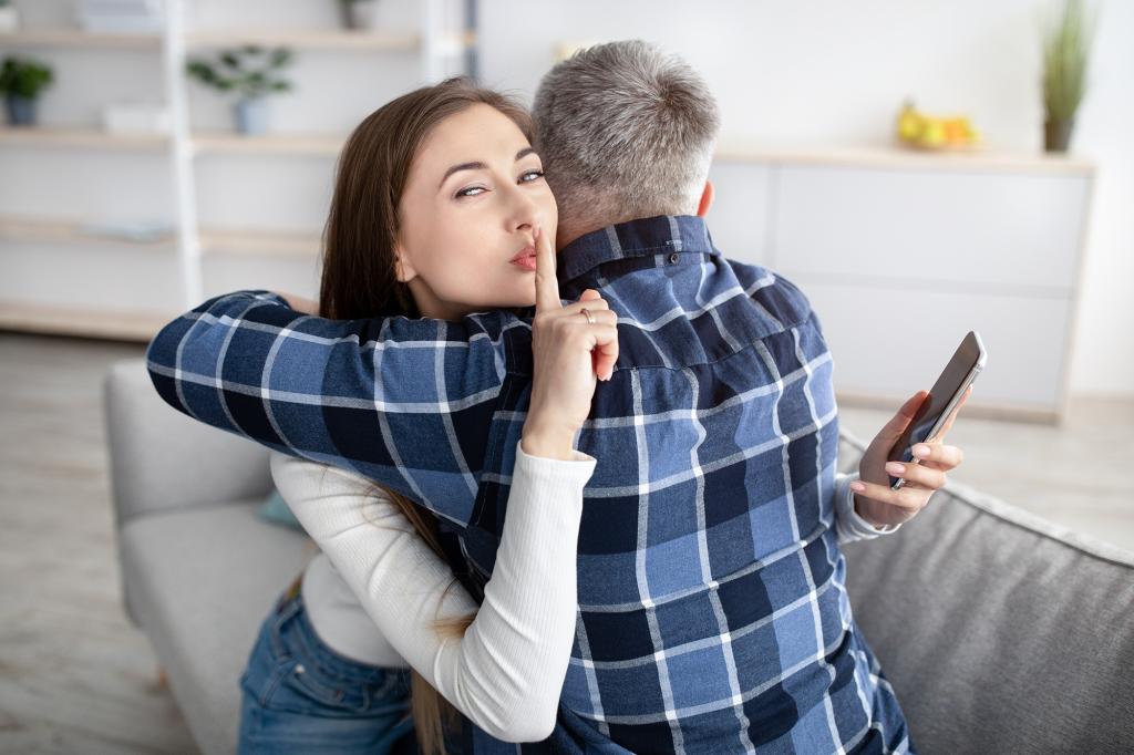 Beautiful mature woman hugging her husband