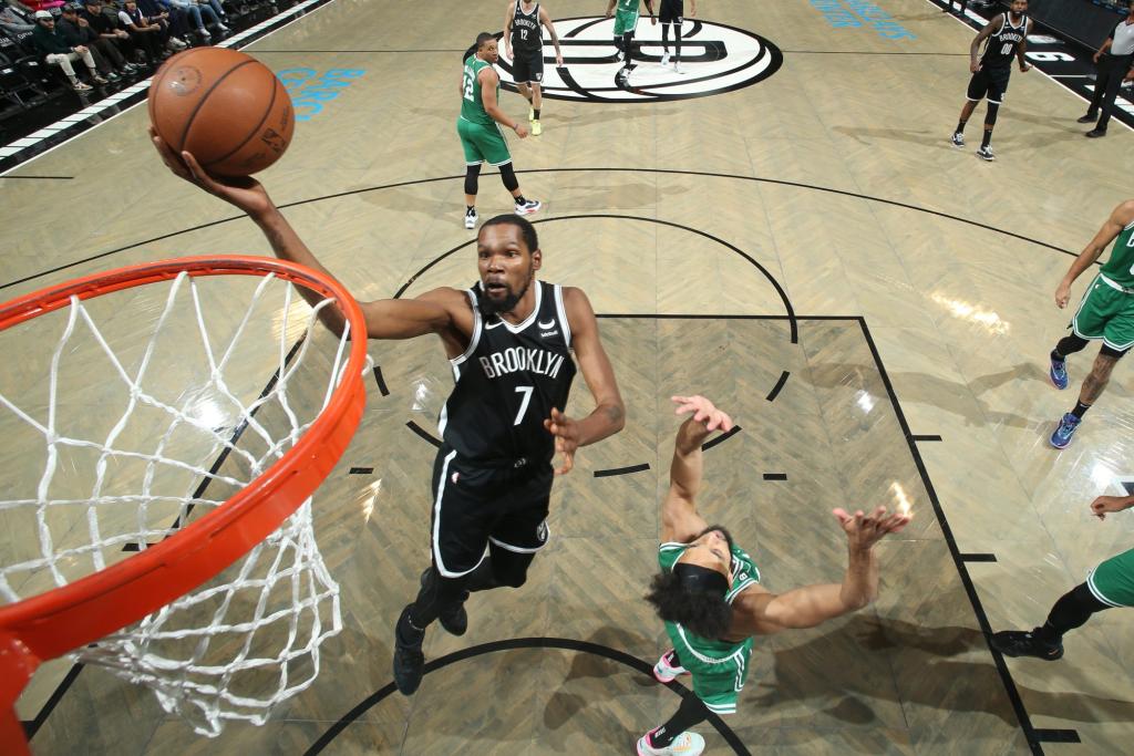 Kevin Durant #7 of the Brooklyn Nets drives to the basket during the game against the Boston Celtics on December 4, 2022 at Barclays Center in Brooklyn, New York.