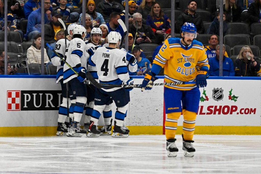 Jets left wing Kyle Connor (81) is congratulated by teammates after scoring against the St. Louis Blues 