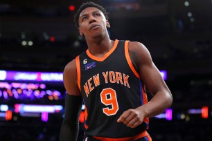 Knicks guard RJ Barrett reacts on the court during the first half of a game against the 76ers on Dec. 25, 2022.