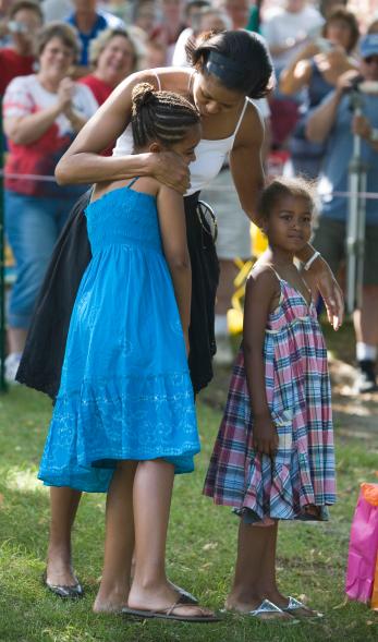 Michelle Obama and her daughters.